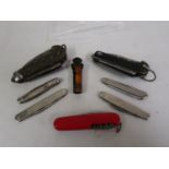 Two early folding pen knives together with a small quantity of other pen knives and a whistle