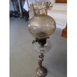 Early 20th Century silver plated oil lamp, the hobnail cut glass oil well supported by a classical