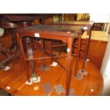 Pair of reproduction mahogany rectangular occasional tables on square cut supports with crossover