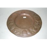 Circular Arts and Crafts copper wall plate embossed with fruit, 17.5ins diameter