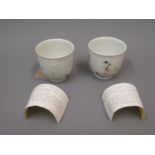Pair of Chinese Nanking Cargo Daisy Terrace pattern teacups (with Christie's labels, one at fault)