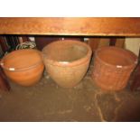 Terracotta garden planter decorated with various classical figures, another terracotta planter