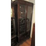 Mid 20th Century oak display cabinet having two leaded glazed doors with adjustable shelves above