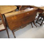 19th Century figured rosewood sutherland table on twin end turned supports with splayed feet,