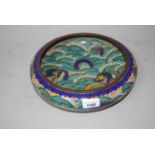 Large low cloisonne fruit bowl decorated with dragons in rough seas, bearing character mark to base,