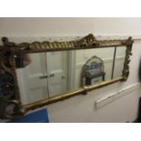 19th Century carved and gilded triple plate wall mirror of rococo design, 51ins x 20.5ins