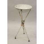 19th Century campaign washstand, the enamel bowl on a folding painted wrought iron stand, 14ins x