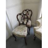 Set of four Victorian carved walnut balloon back dining chairs with overstuffed seats on cabriole