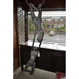 Mid 20th Century silvered composition hanging sculpture of two circus performers, 49ins high