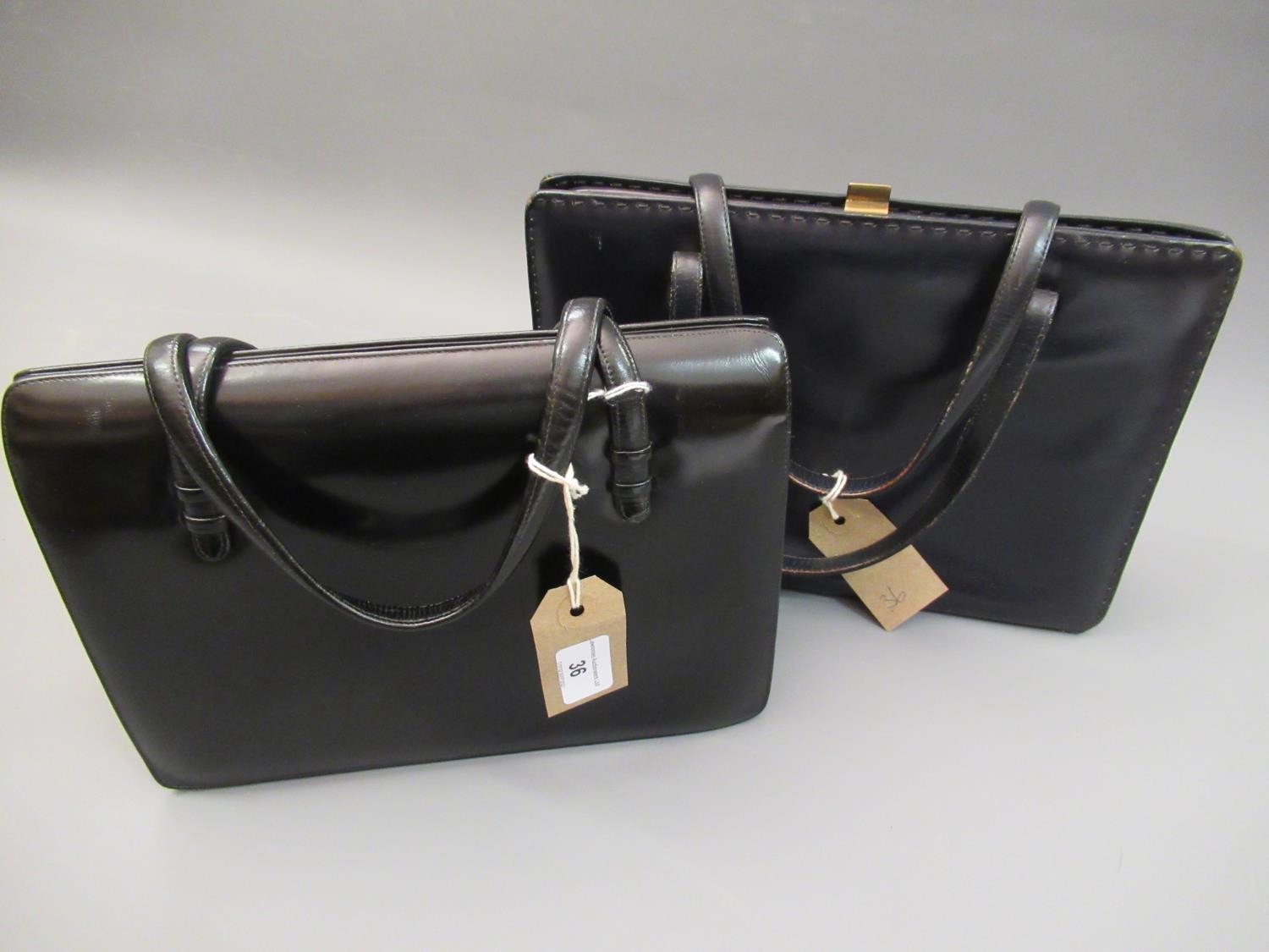 Two vintage black leather handbags