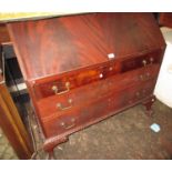 1920's Mahogany bureau with a fall front above three drawers, raised on carved cabriole claw and