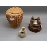Pre-Columbian style figural candlestick together with a pottery vase and cover, 8ins high and a