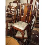Set of four 20th Century Queen Anne style dining chairs, the splat backs above floral upholstery