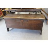 17th Century oak plank coffer, the hinged moulded lid above a chip carved front, carved with the