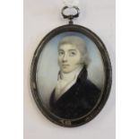 18th Century English school, watercolour portrait miniature of a young man looking upwards, 68mm x