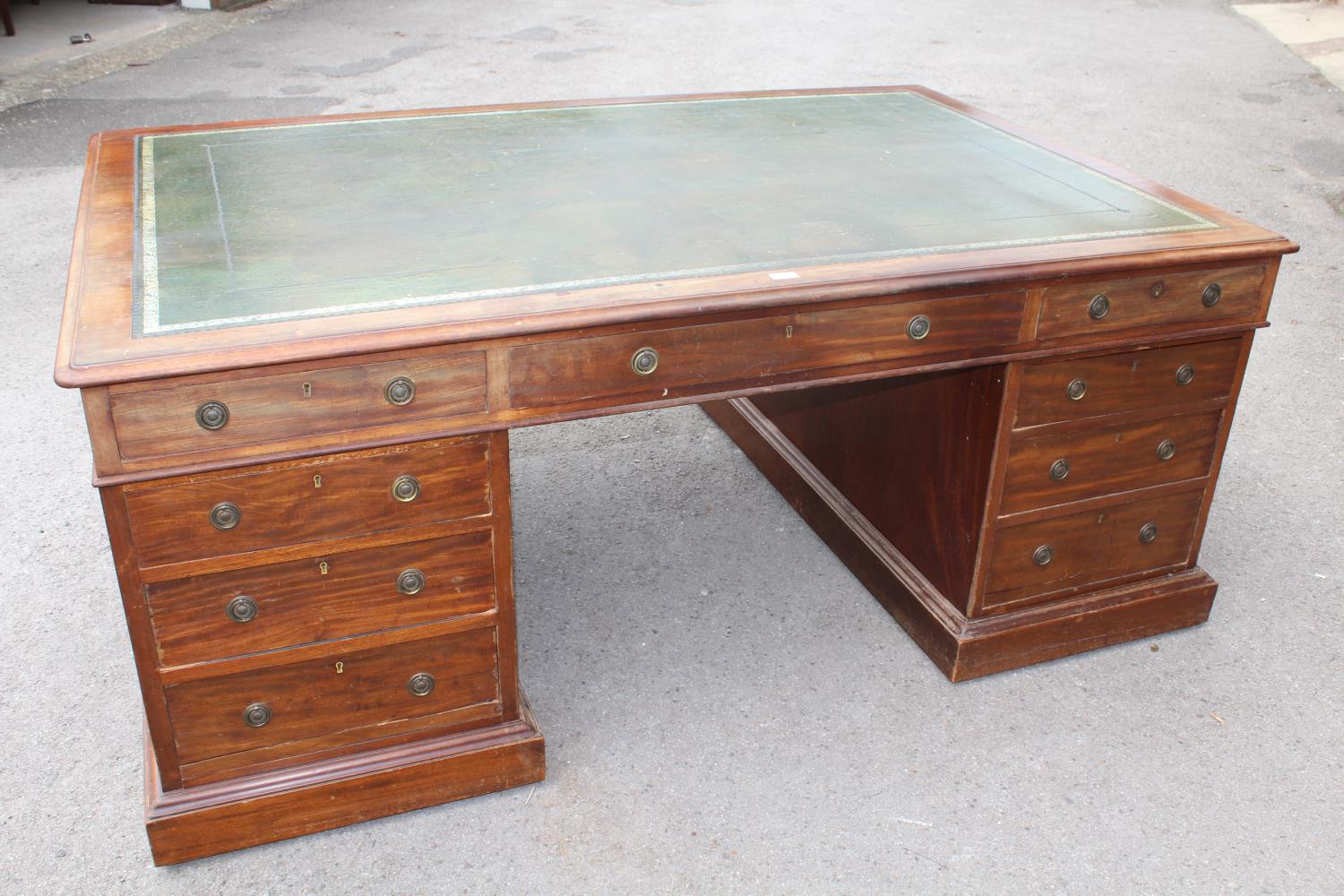 Victorian mahogany twin pedestal partners desk, the leather inset top above a typical arrangement of