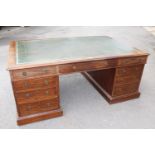 Victorian mahogany twin pedestal partners desk, the leather inset top above a typical arrangement of