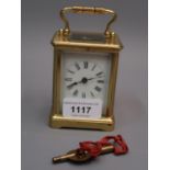 Small early 20th Century gilt brass carriage clock, the enamel dial with Roman numerals, 4.5ins high