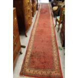 Serabend runner with an all-over Herati design on red ground with borders, approximately 20ft x