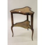 20th Century triangular shaped two tier leather inset table, the undertier with brass gallery,