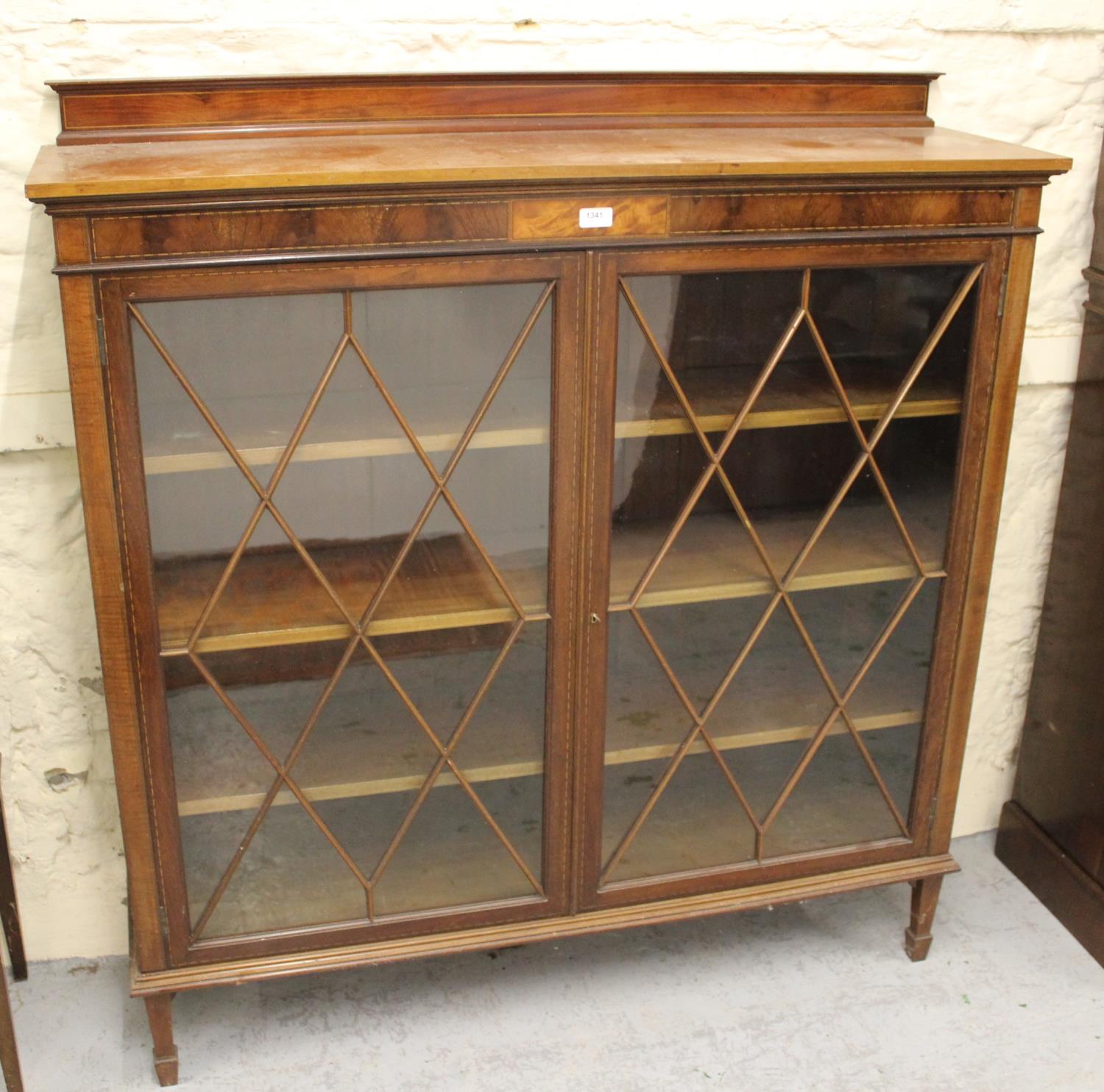 Edwardian mahogany and chequer line inlaid bookcase with a pair of astragal glazed doors enclosing