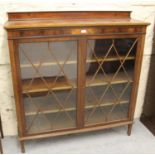 Edwardian mahogany and chequer line inlaid bookcase with a pair of astragal glazed doors enclosing