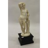 19th Century carved marble figure of Apollo leaning on a tree stump with quiver, 24ins high (