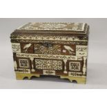 North African hardwood bone and ivory inlaid trunk, circa 1920 / 30, the hinged moulded cover