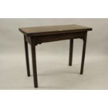 George III rectangular mahogany fold-over tea table on square chamfered supports