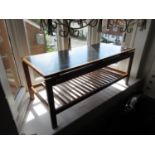 Mid 20th Century Danish teak rectangular occasional table, the black inset ' floating ' top above