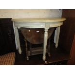 Painted half round side table on turned supports in antique style