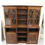 Mahogany and inlaid breakfront bookcase, the moulded cornice above central open shelves, flanked