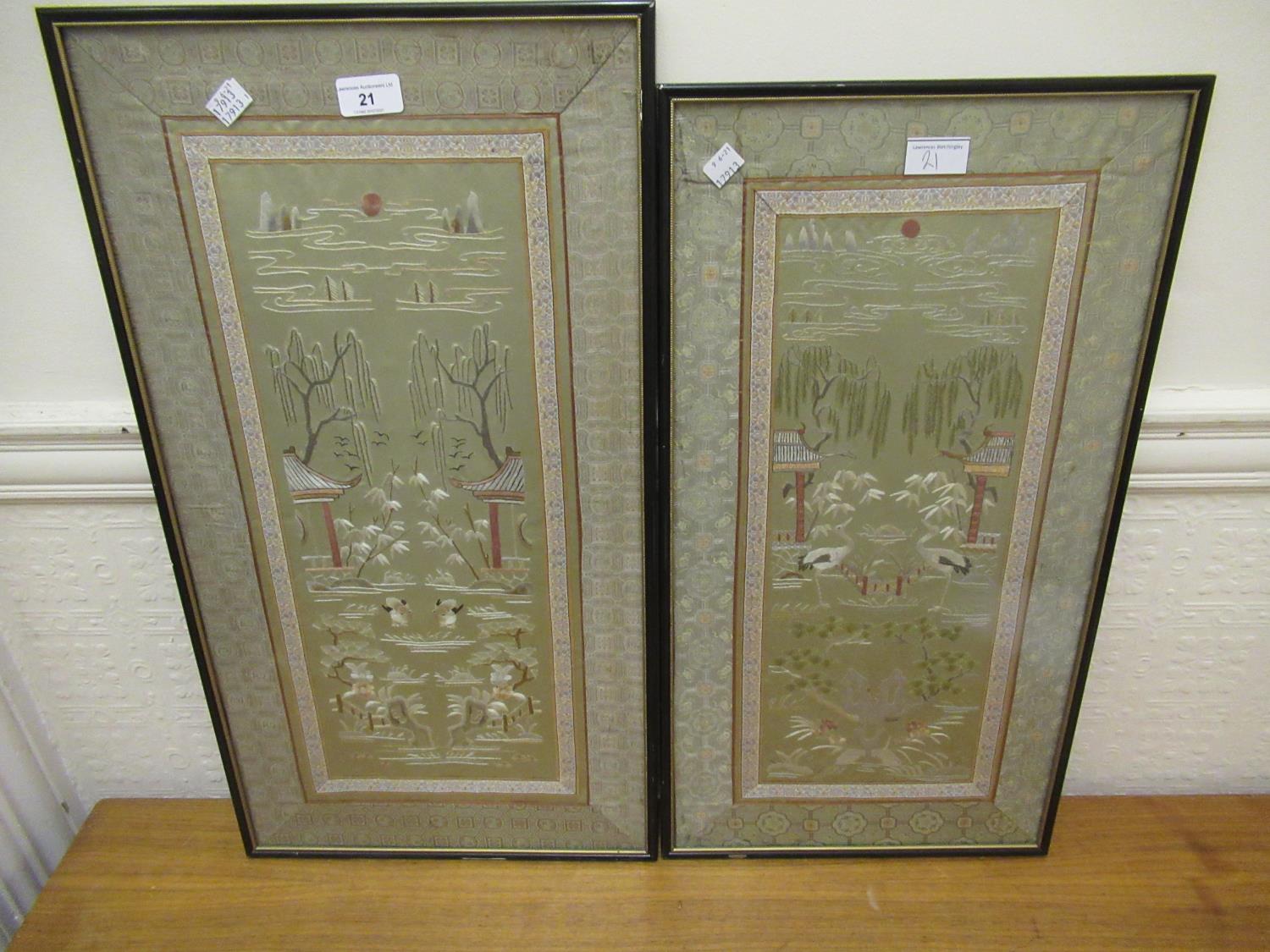 Two Chinese silkwork sleeve type panels of birds and buildings in landscapes, framed, each 9ins x