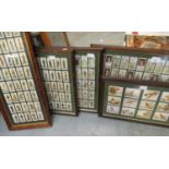 Group of five framed sets of cigarette cards including Wills, Cricketers and John Player -