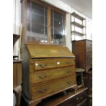 Edwardian mahogany and satinwood crossbanded bureau with an associated bookcase top