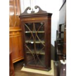 George III mahogany and inlaid hanging corner cabinet with swan neck pediment