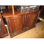 19th Century mahogany side cabinet with two bow fronted doors flanked by spiral turned pilasters, on
