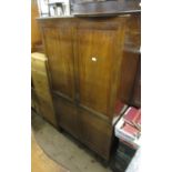 Edwardian mahogany wardrobe, the moulded cornice above a pair of panelled and moulded doors