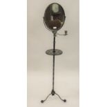 19th Century black japanned gilded metal and papier mache shaving stand, the oval swing frame mirror