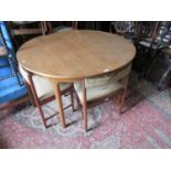 Mcintosh of Kirkaldy mid 20th Century teak circular extending dining table, 48ins diameter, with