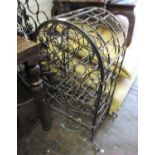 Mid to late 20th Century patinated wrought iron wine bottle cabinet of open work scroll design