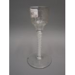 18th Century drinking glass, the stepped conical bowl with etched floral decoration (probably of a