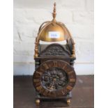 20th Century oak and gilded brass lantern style mantel clock, the dial with Roman numerals, engraved