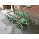 Green painted wooden four wheeled dog cart