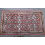 Ziegler Mahal (North West Persian) carpet, the madder filled with bold leafy vines and palmettes,
