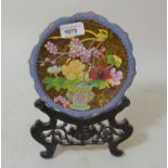 Chinese circular floral decorated cloisonne plate on a wooden stand