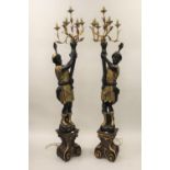 Pair of reproduction carved, gilded and ebonised lamp standards in the form of Venetian blackamoor