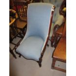 Victorian mahogany nursing chair, the scroll shaped frame with pale blue upholstery on cabriole