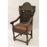 Antique carved oak Wainscott chair with panelled back and seat In good condition but a 19th