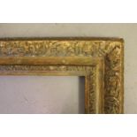 18th Century carved giltwood picture frame, having carved leaf and scroll decoration, 25.5ins x 20.